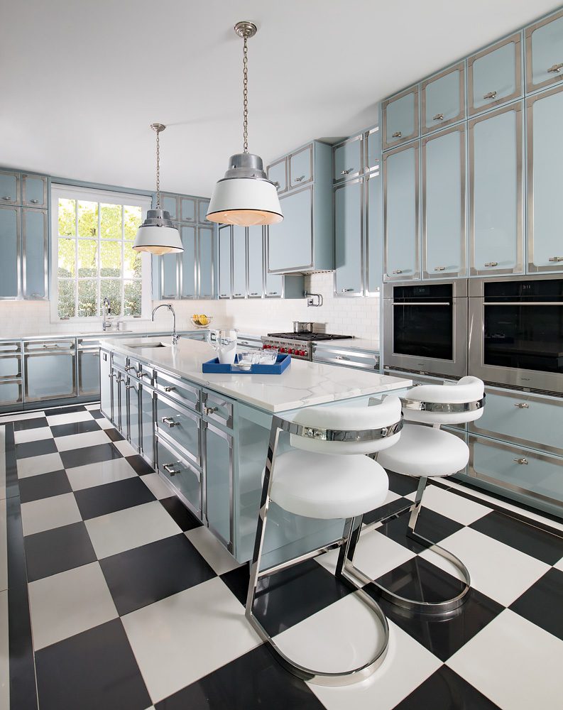 A black and white checkered floor in a kitchen.