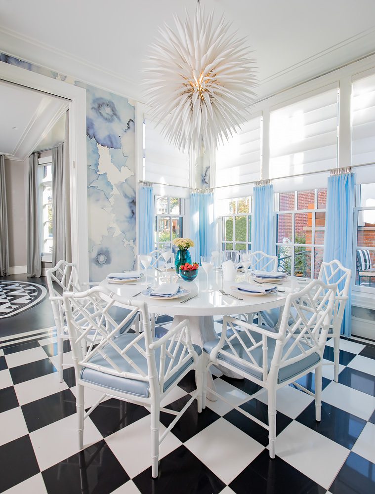 A dining room with a blue and white checkered floor.