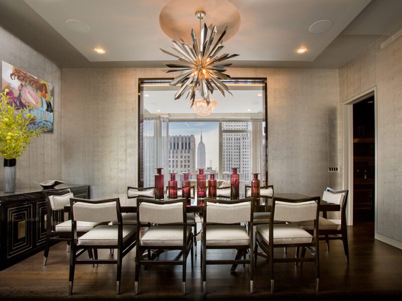 A dining room with a chandelier.