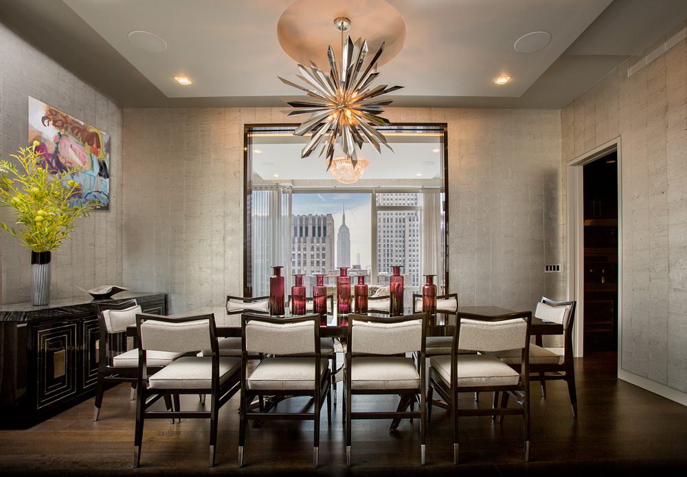 A dining room with a chandelier.