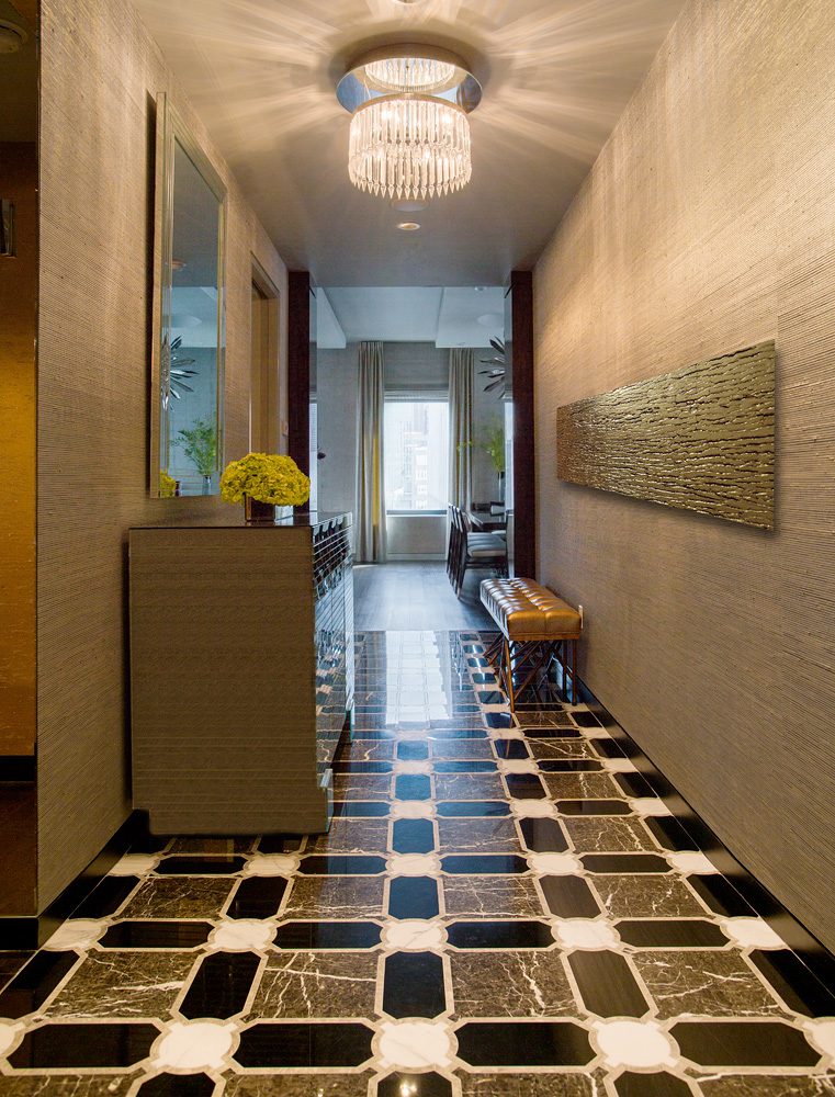 A hallway with a black and white checkered floor.